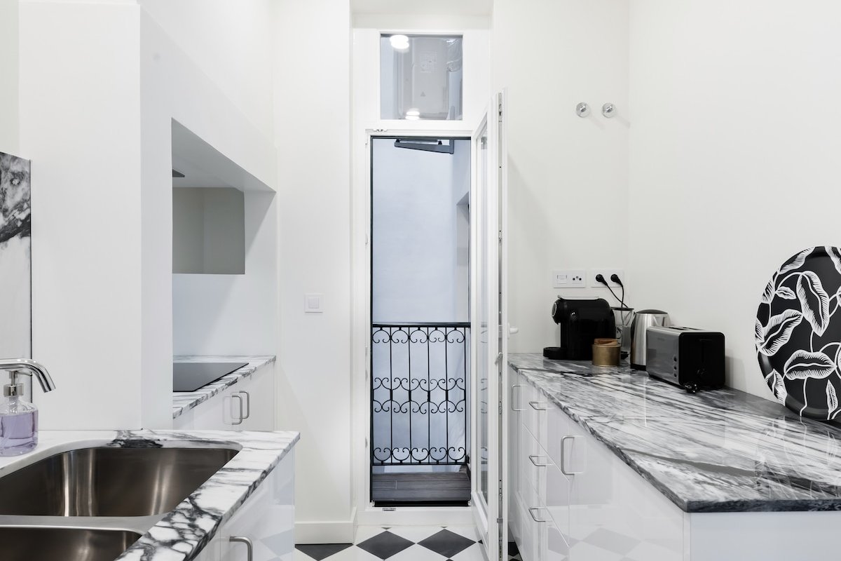 Marble, Molding, and Timber Frames at a Stylish City Retreat gallery image 3