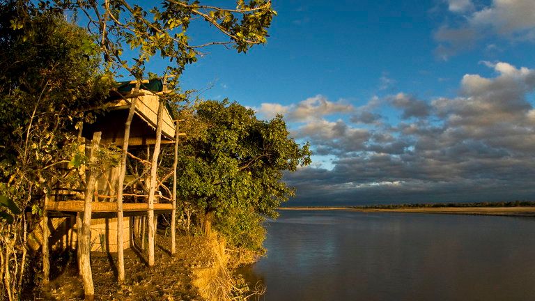 Island BC Chalet - Each reed chalet is built on stilts, overlooking the Luangwa River