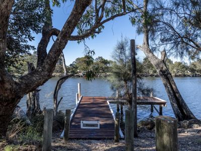 Absolute riverfront modern home, private jetty.