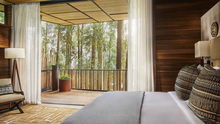 FOREST LODGE KING ROOM - Experience an undisturbed connection with the vast forest beyond, lounging in your luxurious king-sized bedroom, sound tracked by the soothing crackle of local wood in the fireplace. Watch the floor-to-ceiling glass disappear and let the scents and sounds of nature flow in. Follow them out to your secluded open-air viewing deck, enjoy an invigorating al fresco shower or spend precious time relaxing in your standalone bath with undisturbed private views.