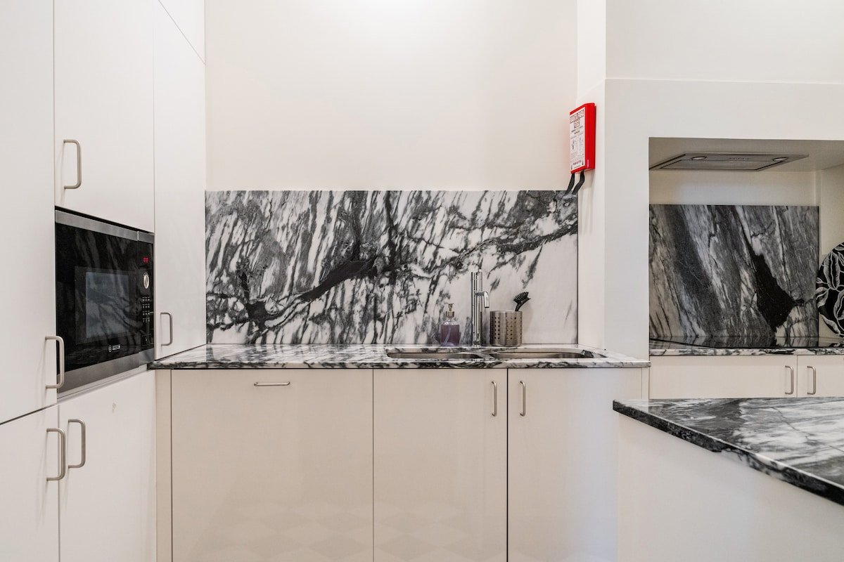 Marble, Molding, and Timber Frames at a Stylish City Retreat gallery image 5