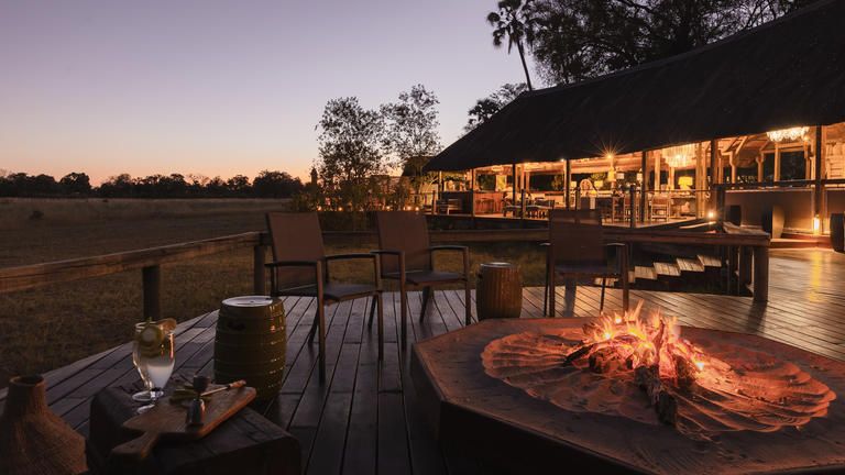 Wilderness Chitabe Lediba - Pre-dinner drinks around the fire is an unmissable safari ritual.