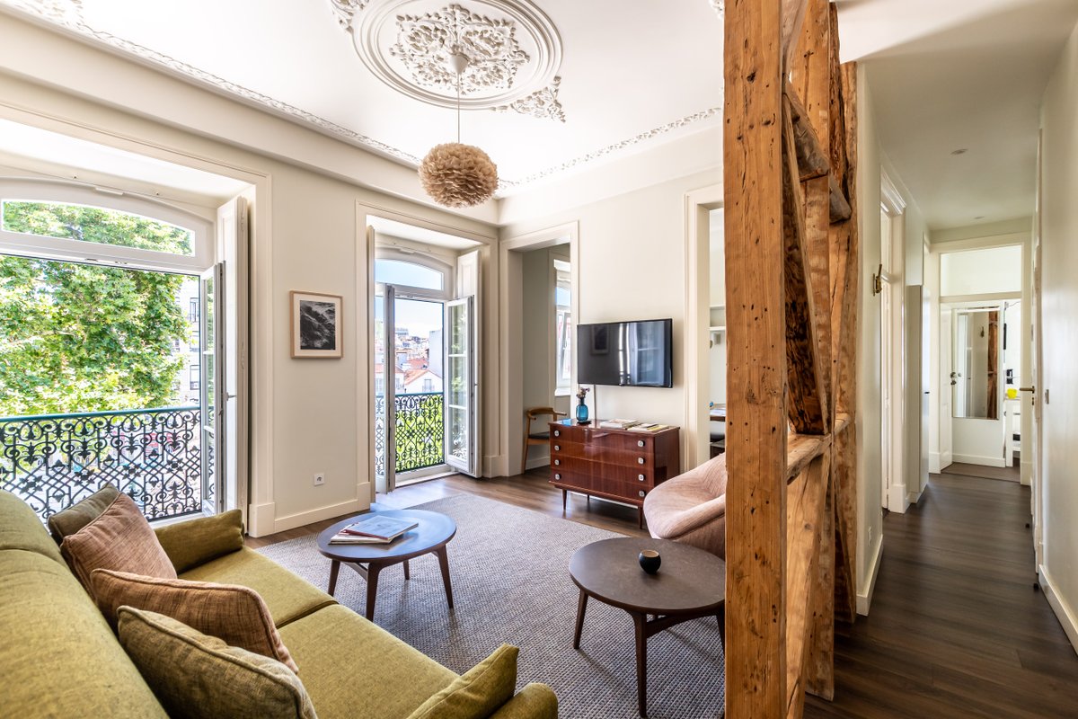 Marble, Molding, and Timber Frames at a Stylish City Retreat