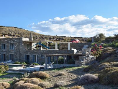 Traditional stone villa with a swimming pool.