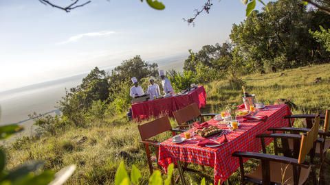 Bush Breakfast overlooking the Masai Mara - Guests once again feel at one with nature with our authentic bush dinner with breathtaking views over the Masai Mara