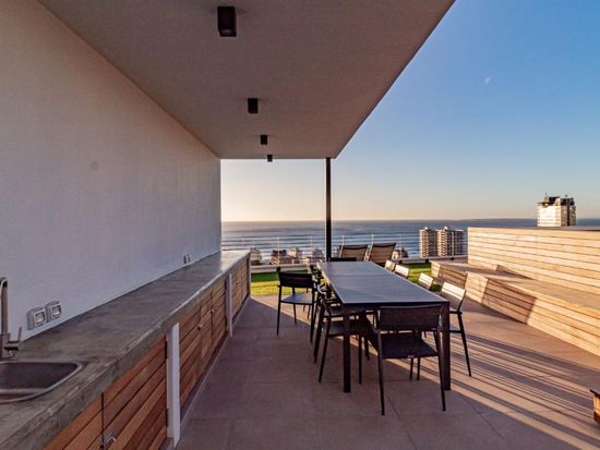 Alpha Sunsets - outside table with views