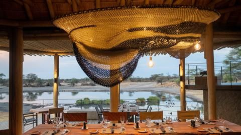 Onguma Camp Kala - Onguma Camp Kala dining area with view over the waterhole