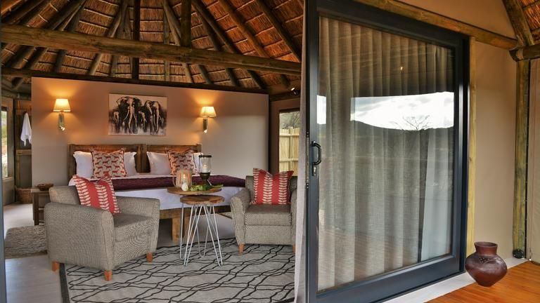 Luxury Tent - 5 luxury tents which accommodate 2 guest. Indoor and outdoor shower with a balcony overview on garden or reserve