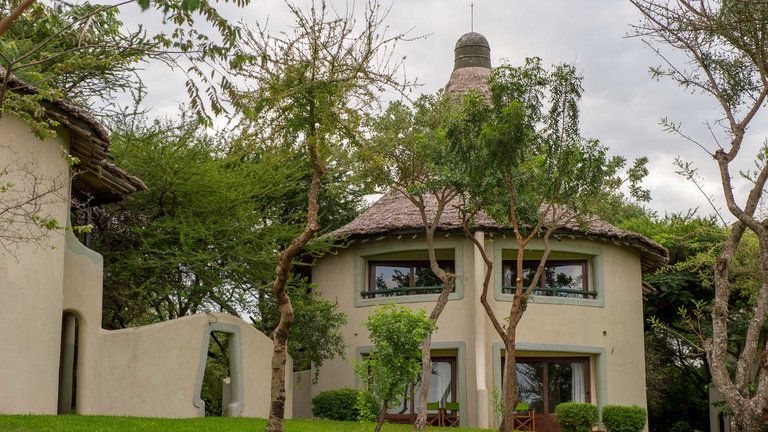Exterior - Lake Manyara Serena Safari Lodge's exterior features swooping avian curves and vibrant wall frescoes that reflect the beauty of the region's unique birdlife. The lodge's circular two-storey rondavels pay homage to tradition while also offering contemporary amenities.