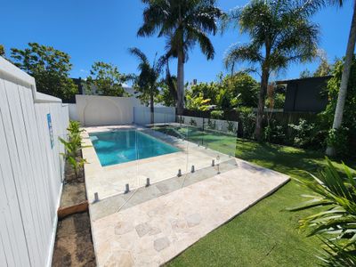 Classic Brisbane Queenslander with a pool and yard