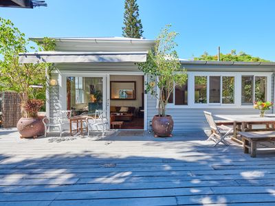Central, outdoor bath, large summery deck.