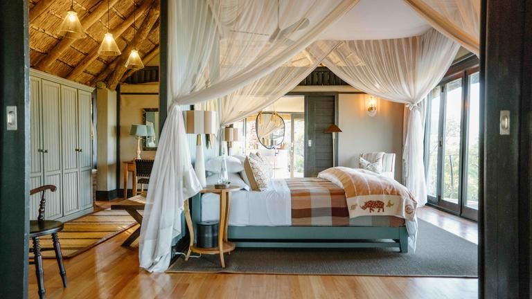 Room Interior - A spacious and thoughtfully designed bedroom that opens out to uninterrupted views of the surrounding wilderness, blending comfort with a deep sense of place.
