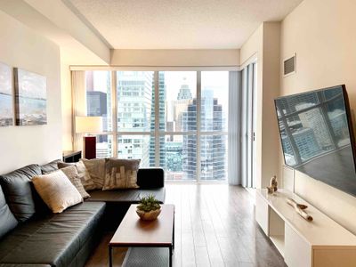Luxury 1+Den condo steps away from CN Tower & Lake