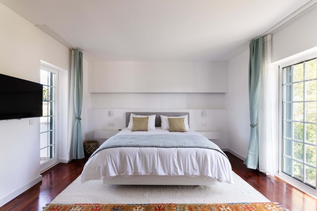 Relaxing home with pine trees, quiet garden & pool gallery image 5