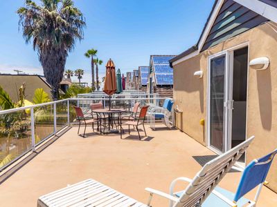Mission Beach House with a rooftop deck