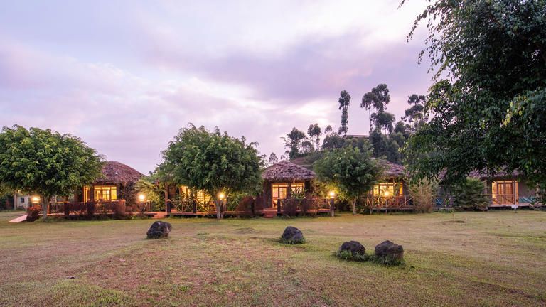 Sunrise at Lake Chahafi Resort - view  of the standard cottages at sunrise with a spacious garden