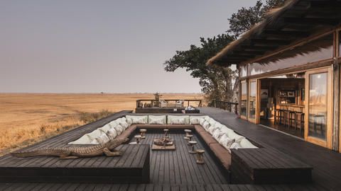 Wilderness Shumba Camp - Pre-dinner drinks around the fire on the deck at Shumba are an unmissable safari tradition.