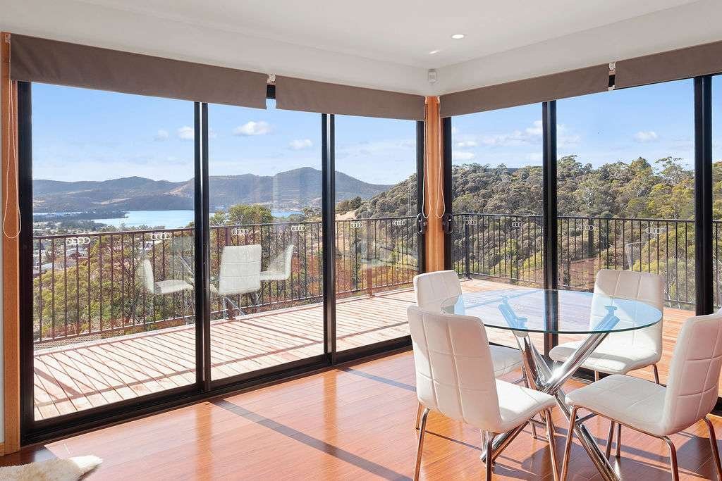 Modern, spacious & sunny home with stunning views. gallery image 2