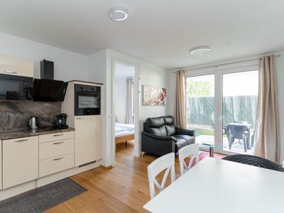 Modern apartment with tiny garden near city center