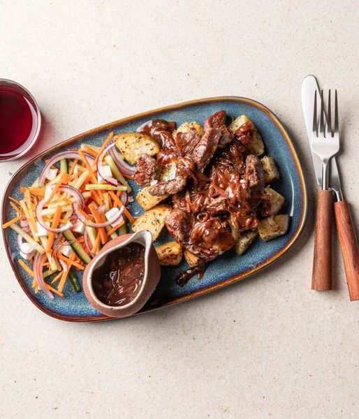 Photo of Potatoes, Ostrich Strips & Onion Gravy