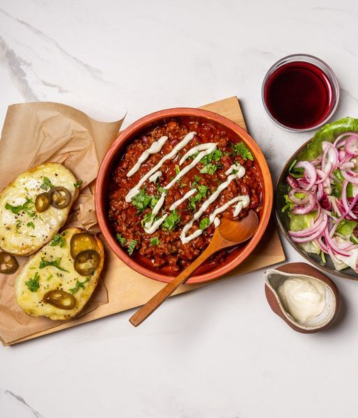 Photo of Baked Cheesy Potato & Ostrich Con Carne