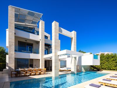 Two private pools, walking distance to the beach!