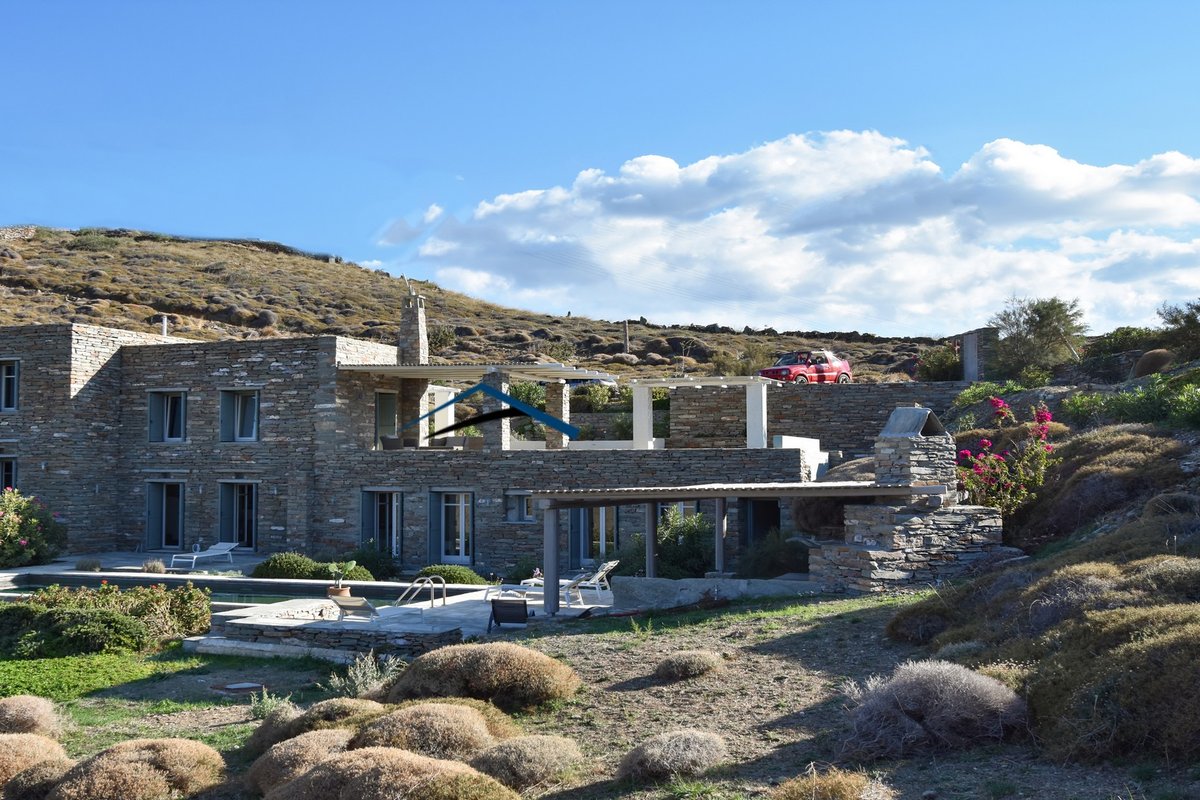 Traditional stone villa with a swimming pool.